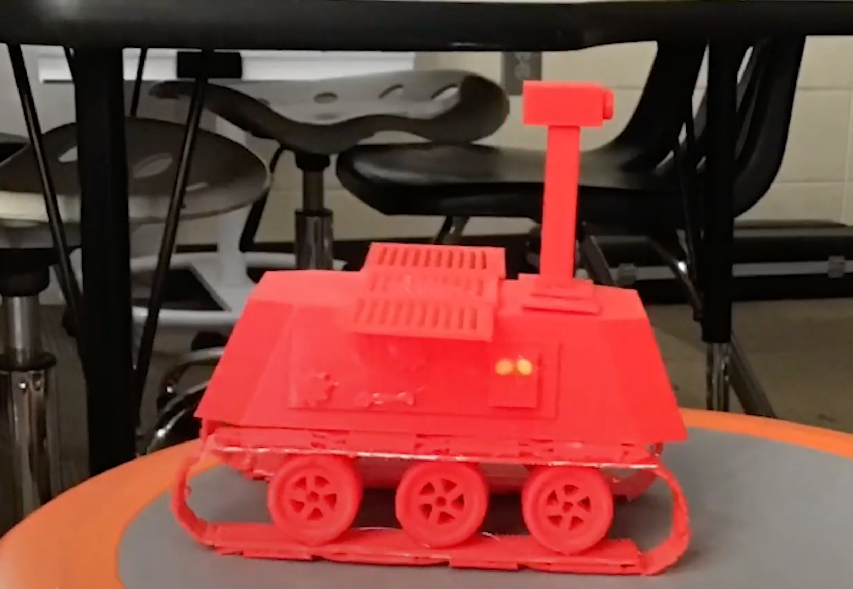 6th grade student at Richmond Hill Middle School holding a 3D printed Mars rover built with MakerBot Sketch Classroom